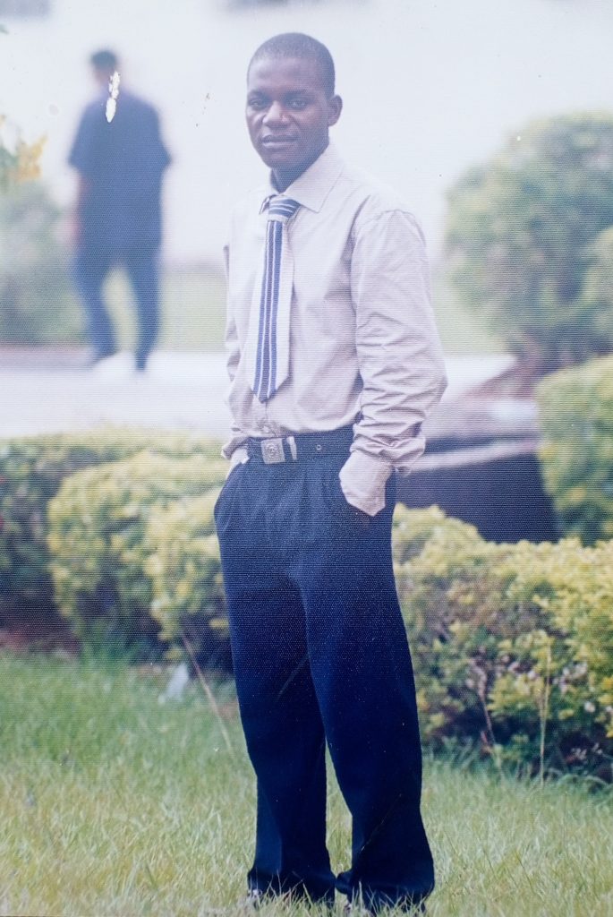 Bem Akaanane standing confidently before spinal cord injury, full of hope and dreams.